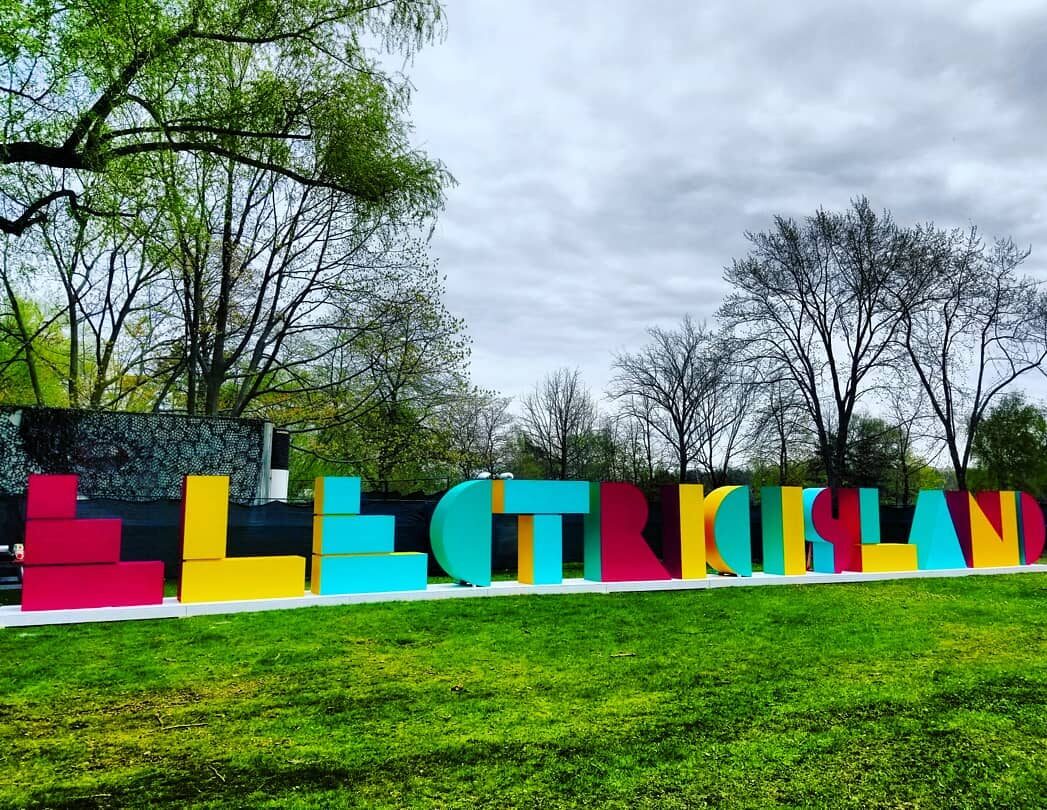 Illuminated storefront sign at night
